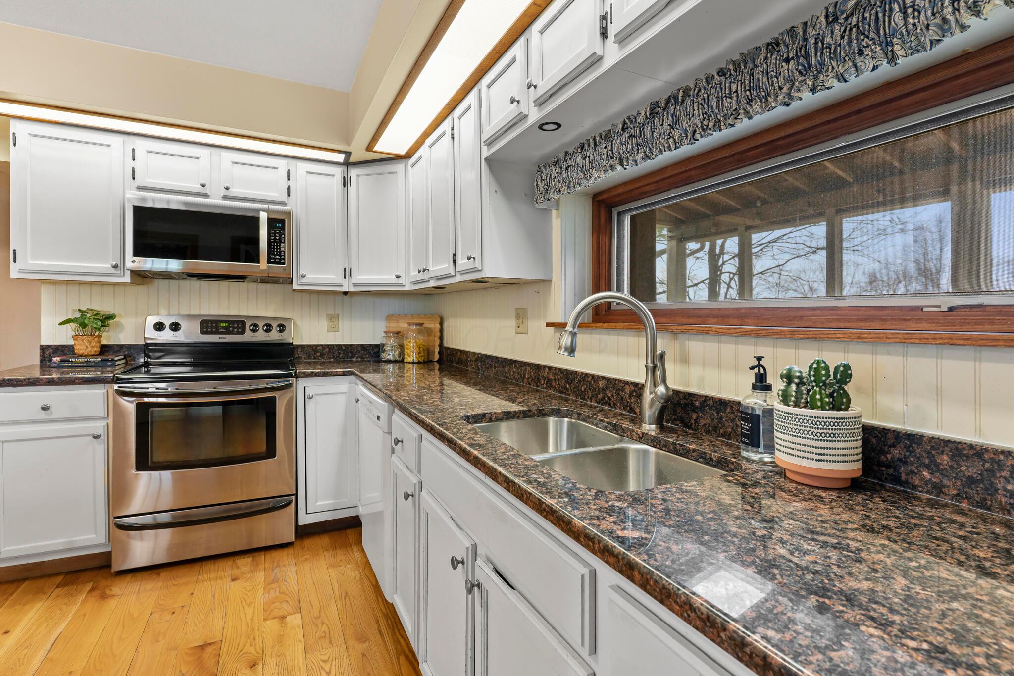 13535 Vans Valley Road Galena, OH 43021 - Photo 14 of 87 Kitchen with view to the back patio