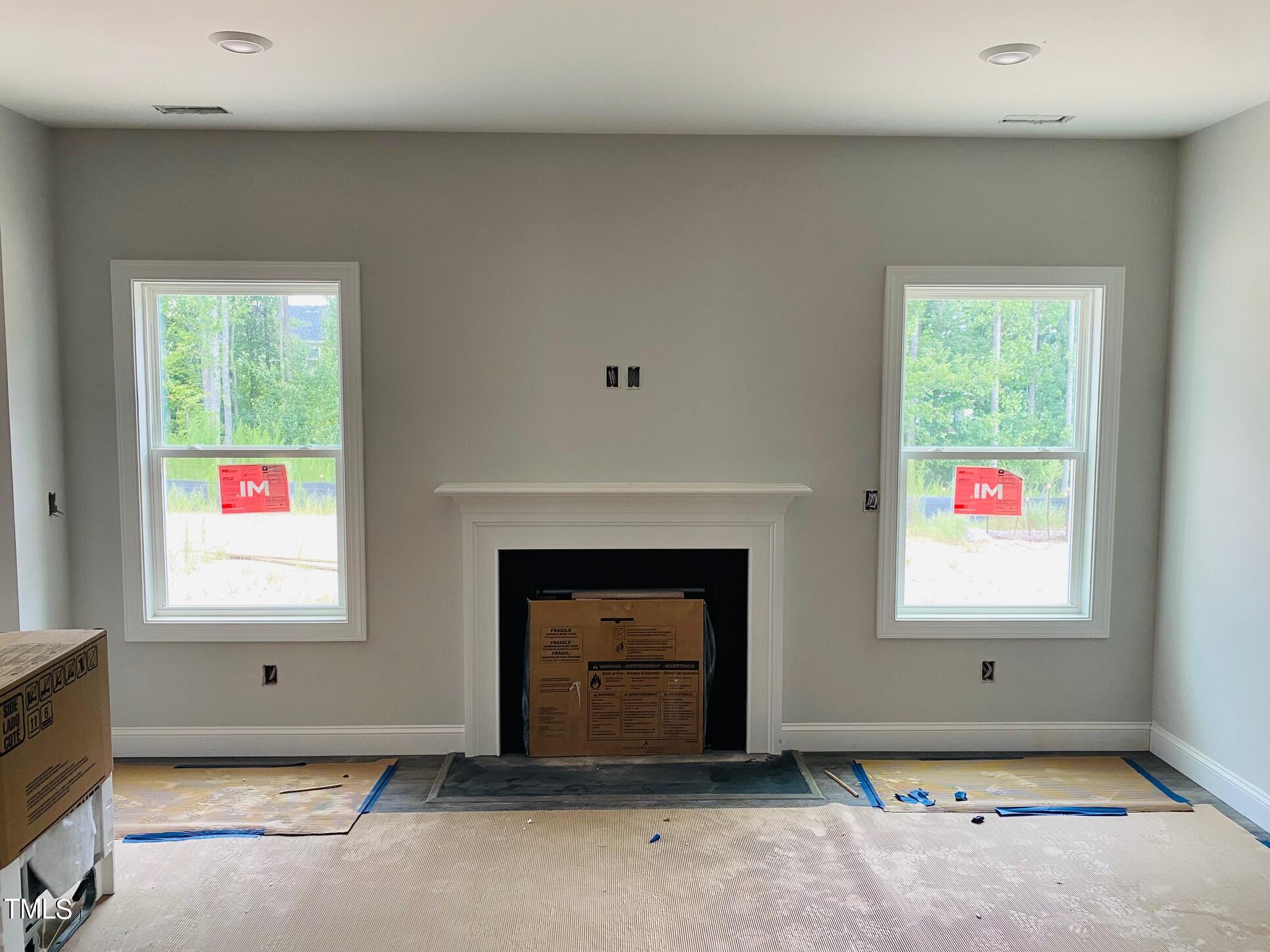817 Putney Hl Road Zebulon, NC 27597 - Photo 3 of 6 an empty room with windows