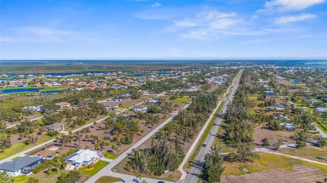 an aerial view of residential building and ocean