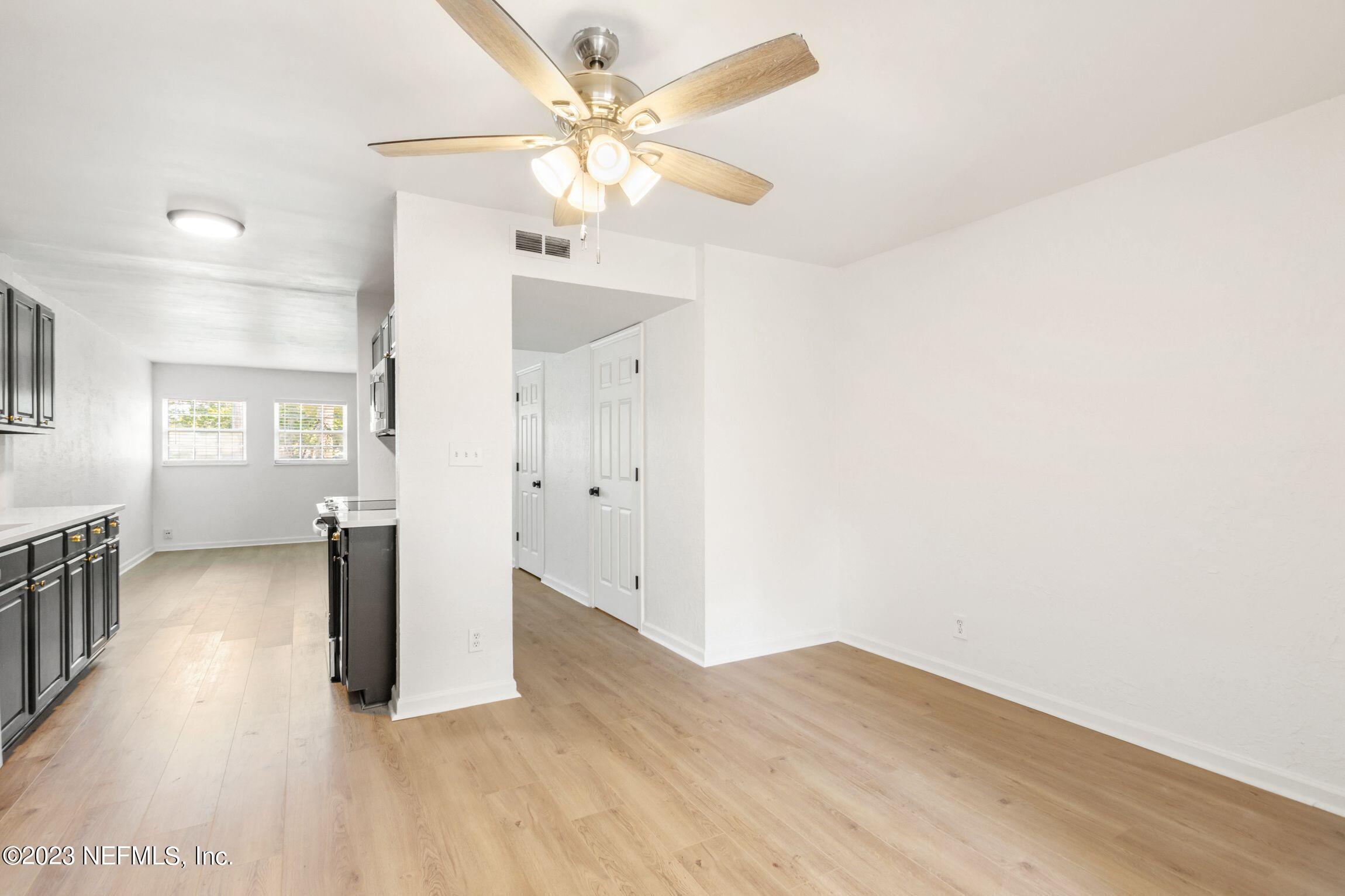 818 Cavalla Road Atlantic Beach, FL 32233 - Photo 11 of 27 a view of a hallway with wooden floor