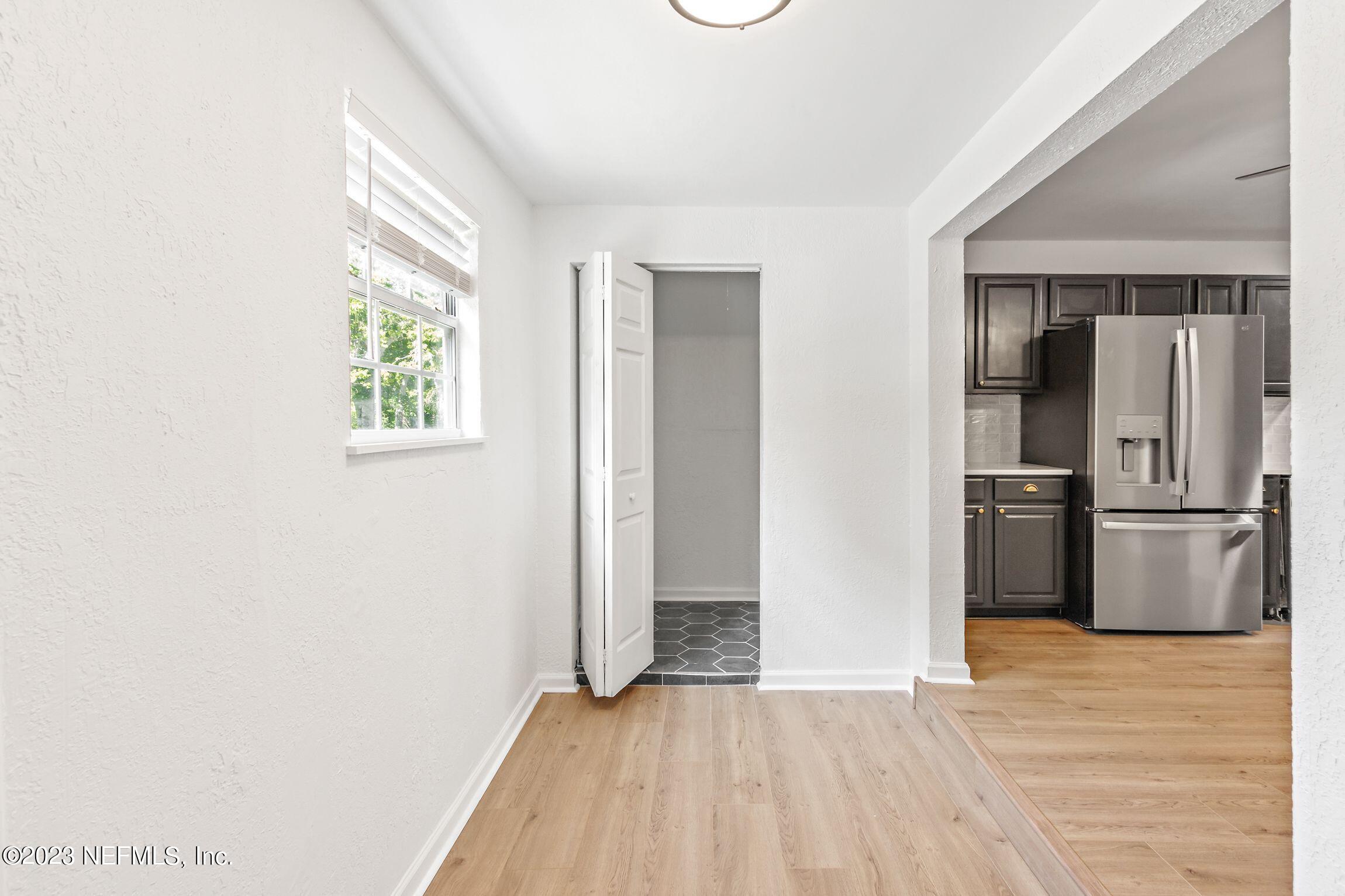 818 Cavalla Road Atlantic Beach, FL 32233 - Photo 13 of 27 a view of a kitchen with a sink refrigerator and wooden floor