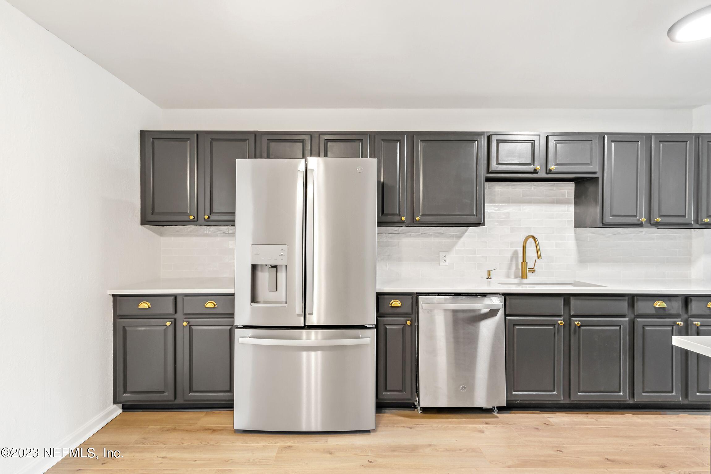 818 Cavalla Road Atlantic Beach, FL 32233 - Photo 10 of 27 a kitchen with stainless steel appliances a refrigerator and a sink
