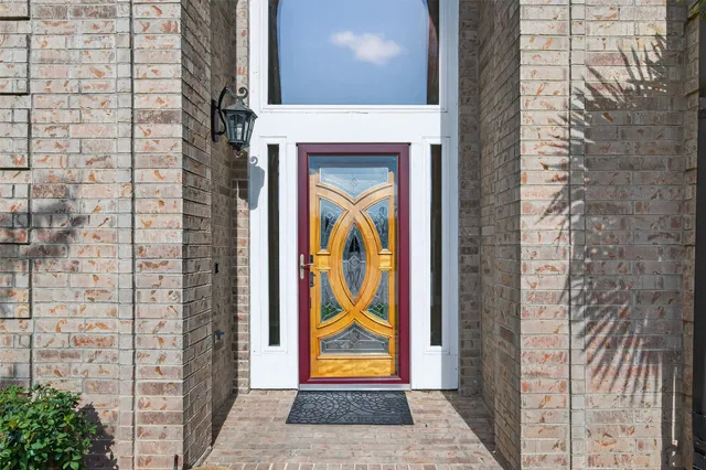 a bathroom with a tub a sink and a large mirror