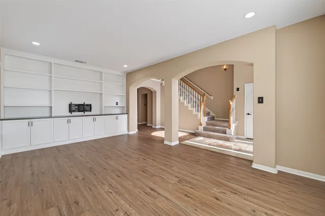 a bathroom with a double vanity sink and mirror