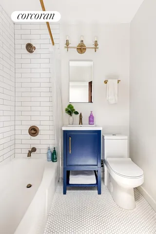 a bedroom with a bed large window with chair and table