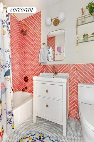 a bathroom with a sink a toilet and bathtub