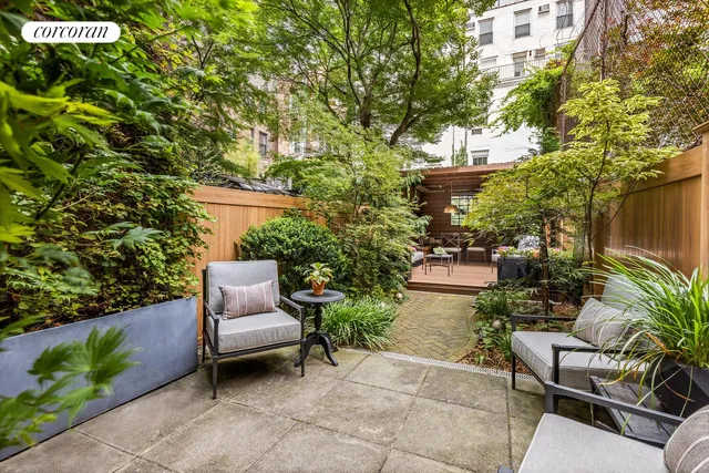 a living room with fireplace furniture and a floor to ceiling window