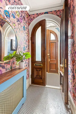 a view of a patio with couches table and chairs and potted plants