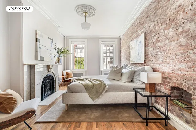 a hallway with a stove top oven and refrigerator