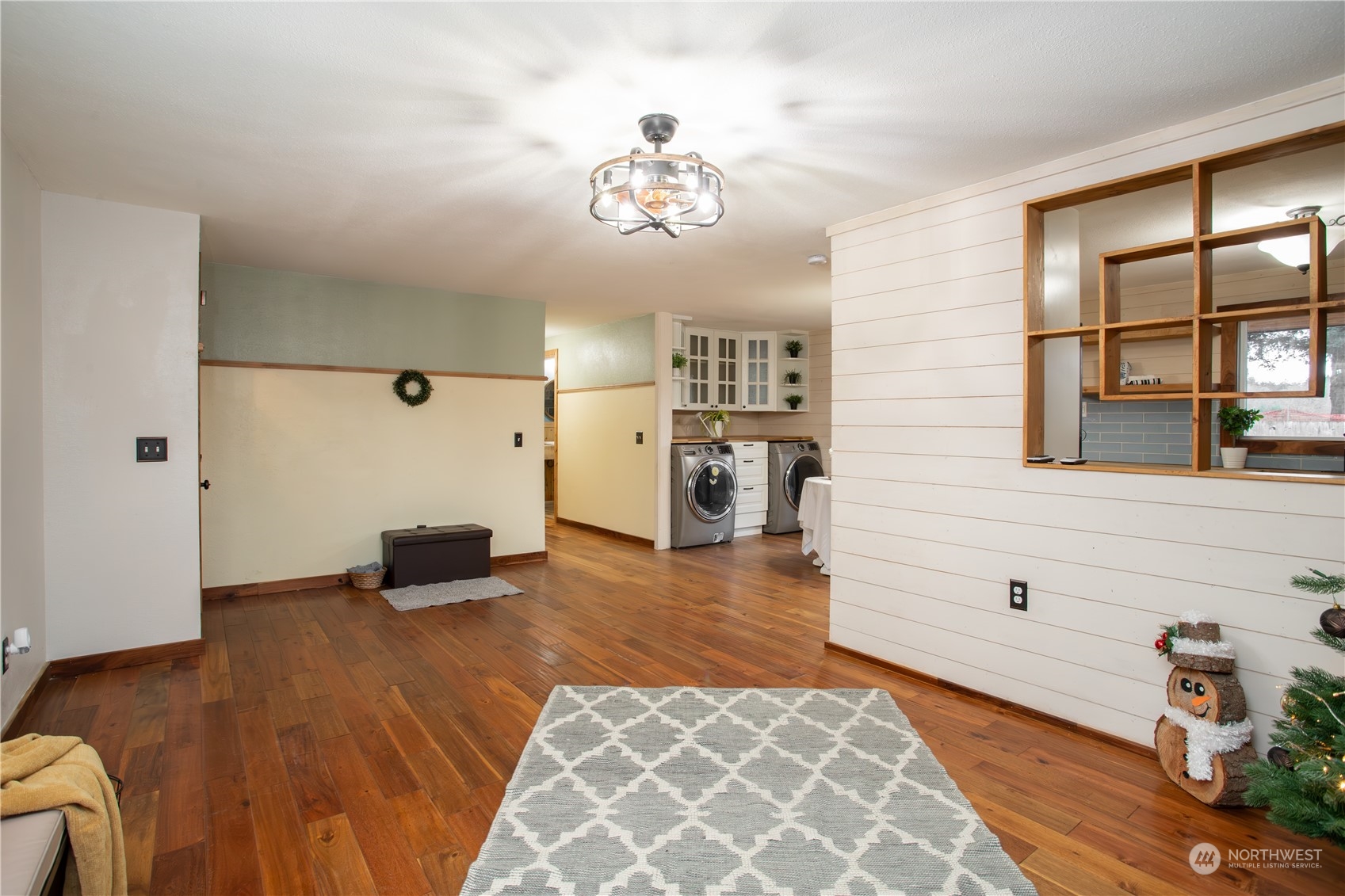 549 McNaught Road South Roy, WA 98580 - Photo 7 of 38 a living room with furniture and a chandelier