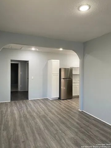 a view of a kitchen with wooden floor