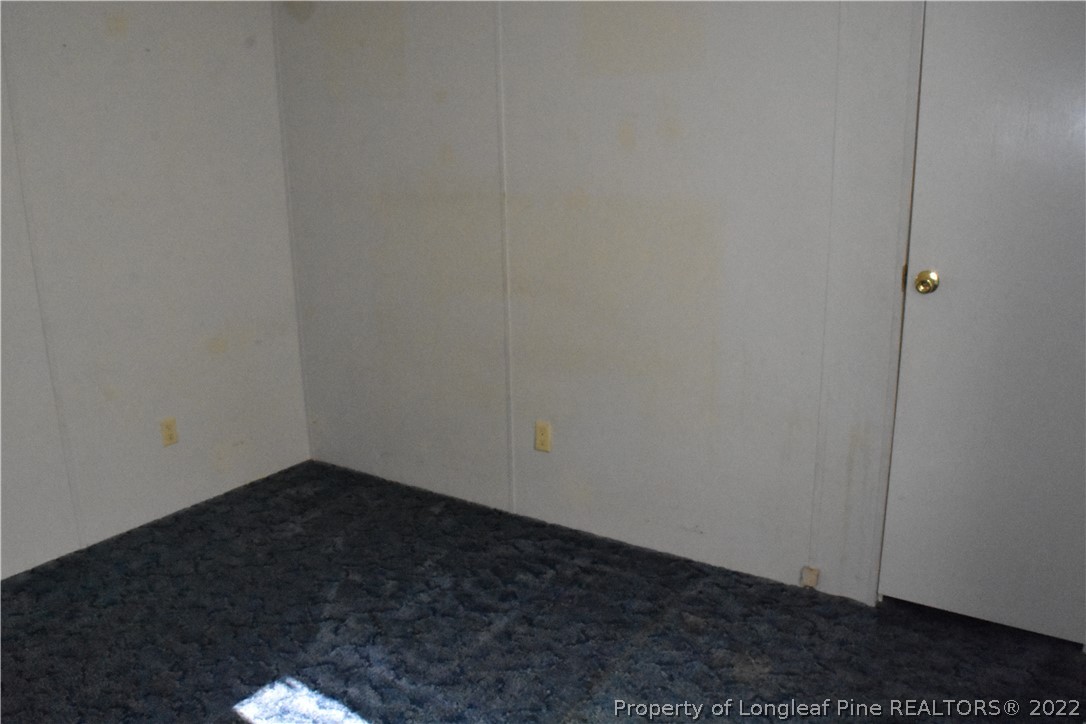 4131 Carroll Store Road Autryville, NC 28318 - Photo 12 of 18 a view of small space with wooden floor