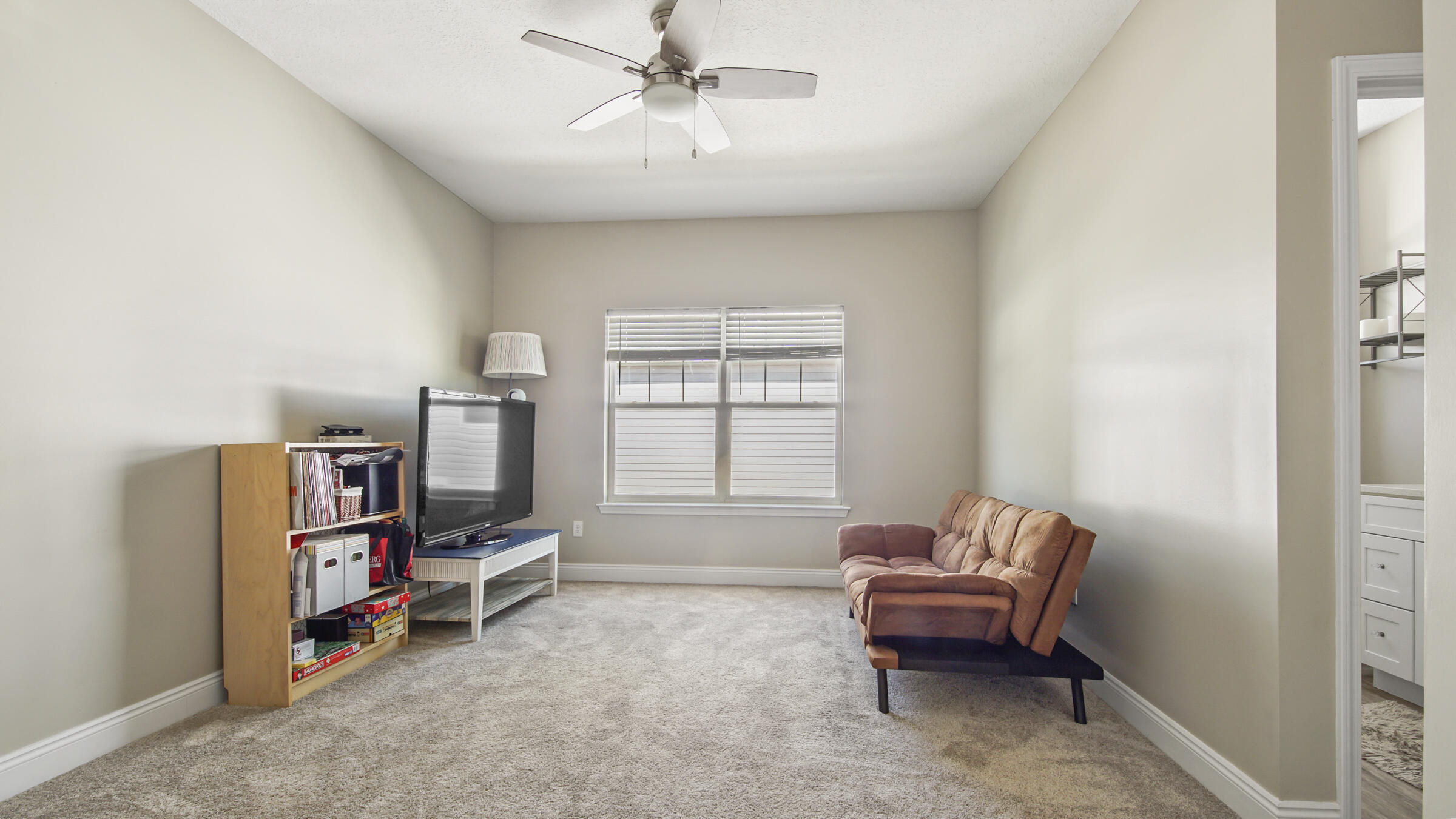 275 Indian Woman Road Santa Rosa Beach, FL 32459 - Photo 11 of 43 a living room with furniture a ceiling fan and a window