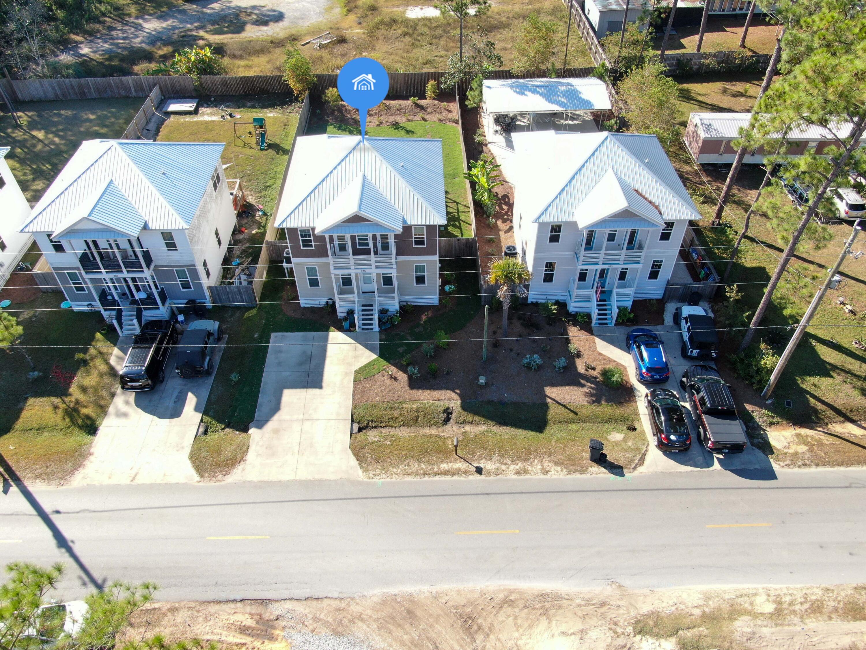 275 Indian Woman Road Santa Rosa Beach, FL 32459 - Photo 24 of 43 a building outdoor space with patio entrance and potted plants