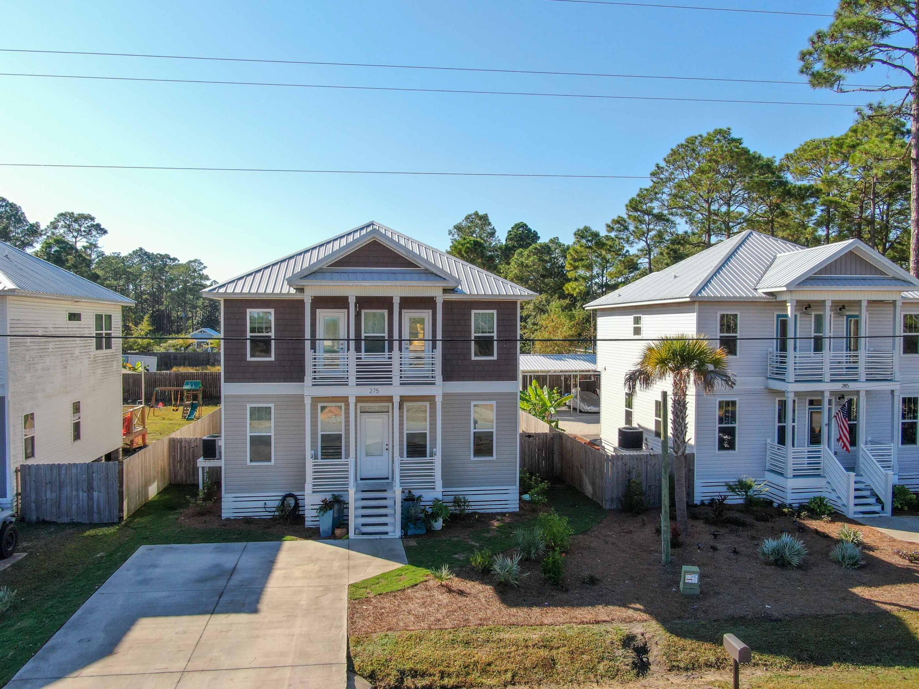 275 Indian Woman Road Santa Rosa Beach, FL 32459 - Photo 27 of 43 a front view of a house with garden