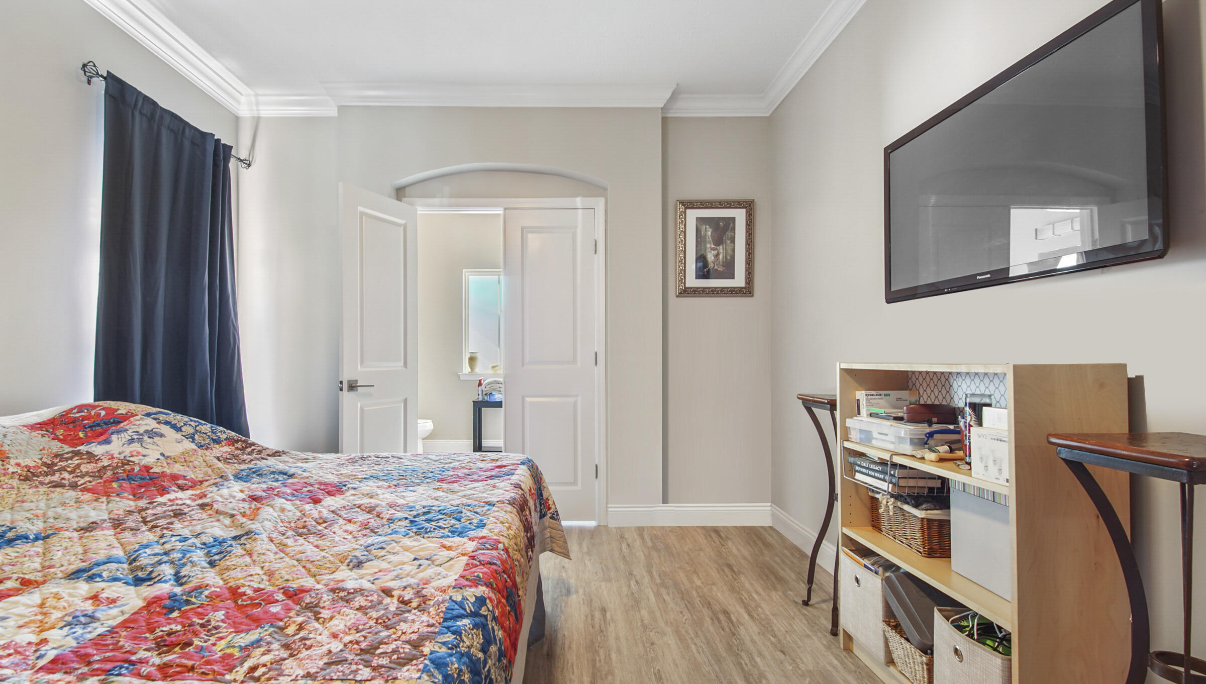 275 Indian Woman Road Santa Rosa Beach, FL 32459 - Photo 35 of 43 a bedroom with a bed and a flat tv screen on a dresser