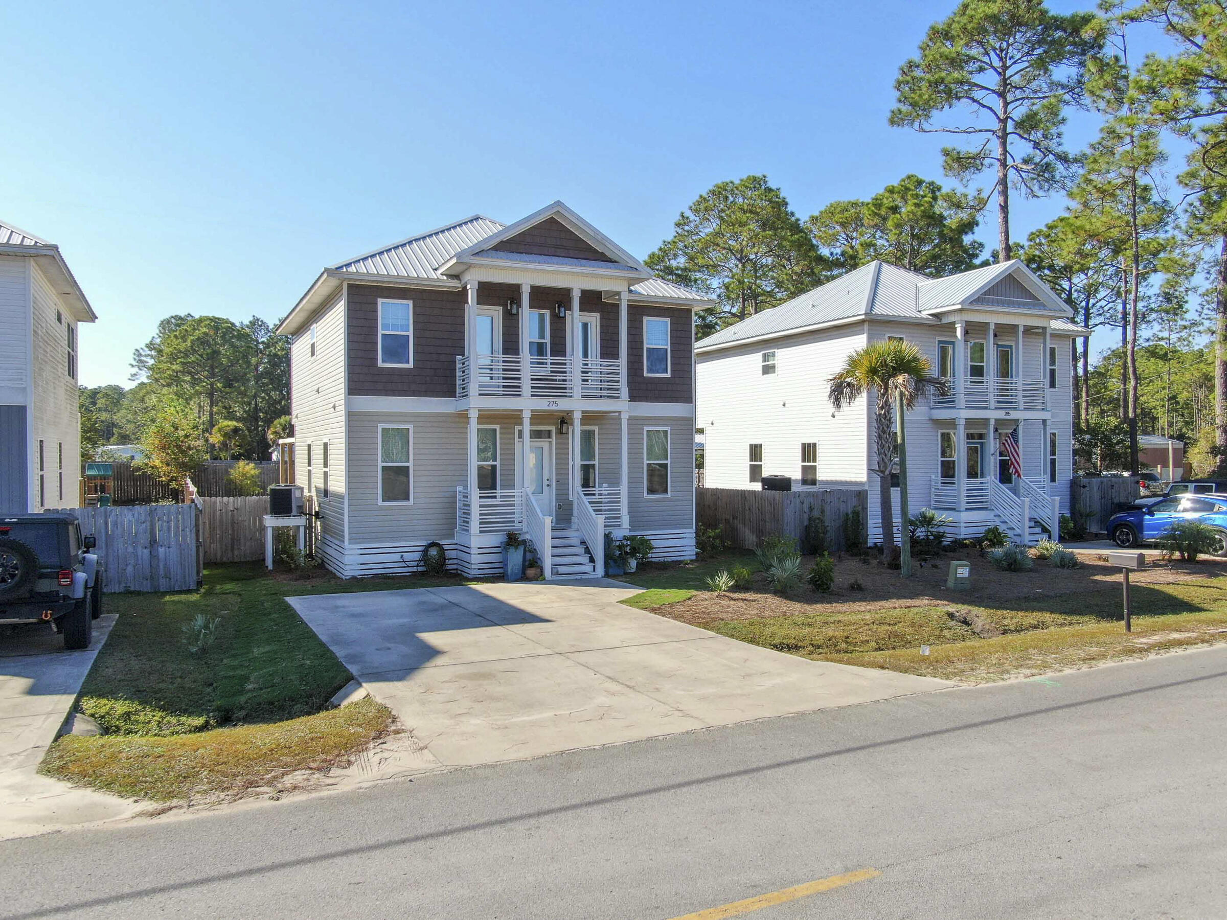 275 Indian Woman Road Santa Rosa Beach, FL 32459 - Photo 41 of 43 a front view of a house with garden