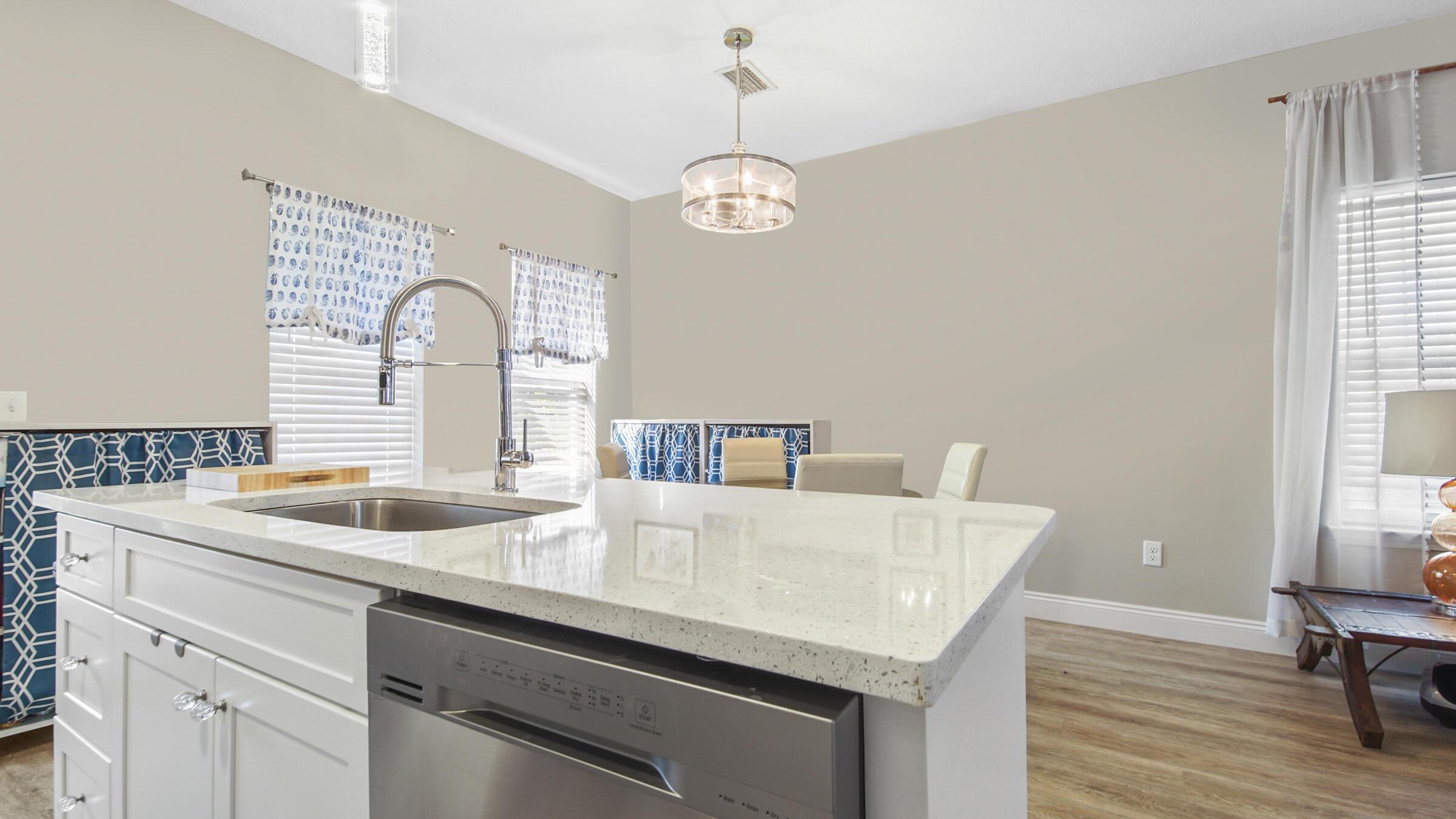 275 Indian Woman Road Santa Rosa Beach, FL 32459 - Photo 7 of 43 a kitchen with sink cabinets and wooden floor
