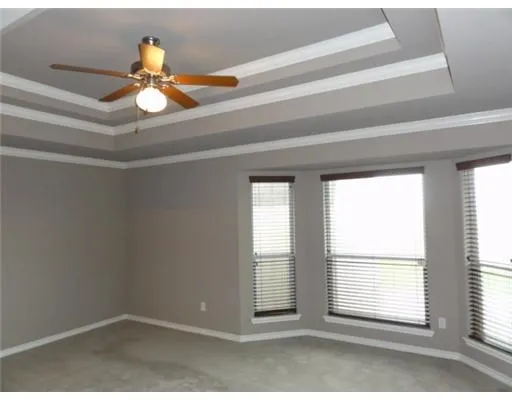 a view of empty room with windows