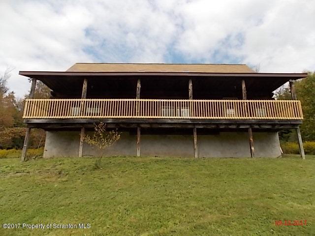 a view of a swimming pool with a balcony
