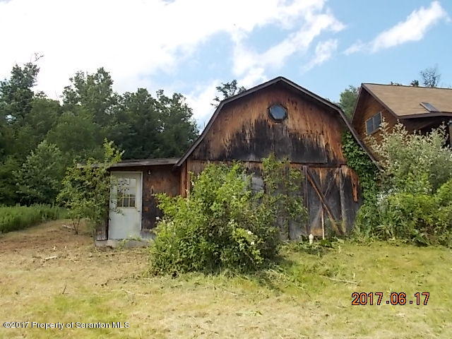 79 Rr 1 Le Raysville, PA 18829 - Photo 5 of 23 a backyard of a house with lots of green space