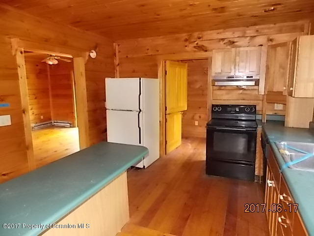 79 Rr 1 Le Raysville, PA 18829 - Photo 8 of 23 a kitchen with a refrigerator stove and a sink