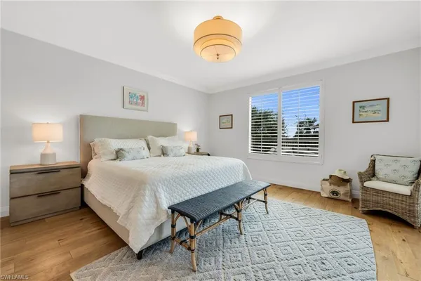 a bedroom with a bed and outer view