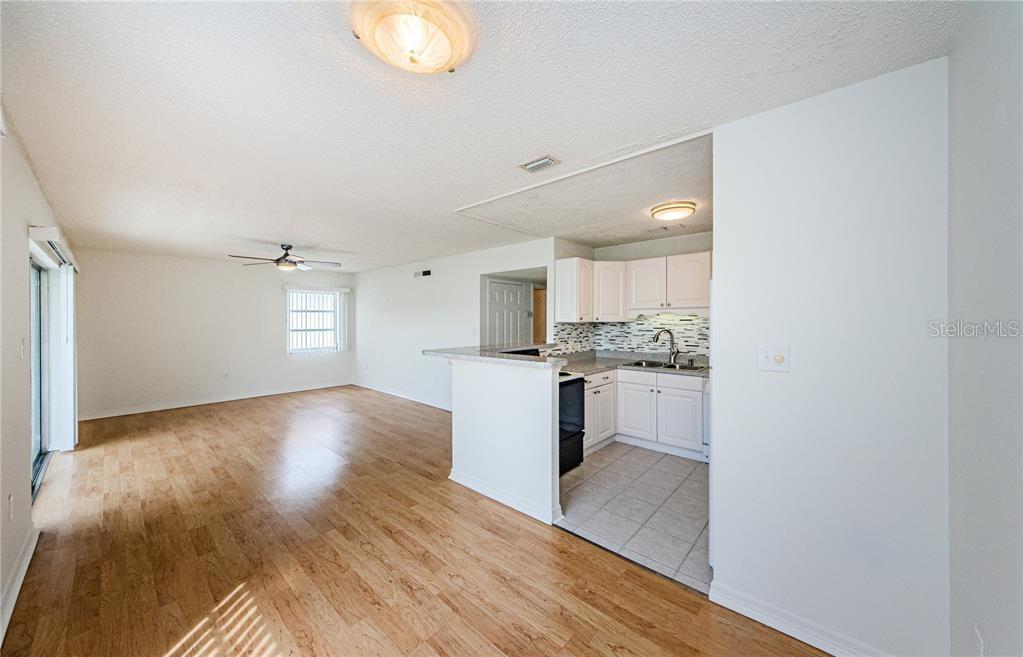 383 South McMullen Booth Road, Unit 68 Clearwater, FL 33759 - Photo 13 of 36 a view of kitchen with wooden floor and electronic appliances