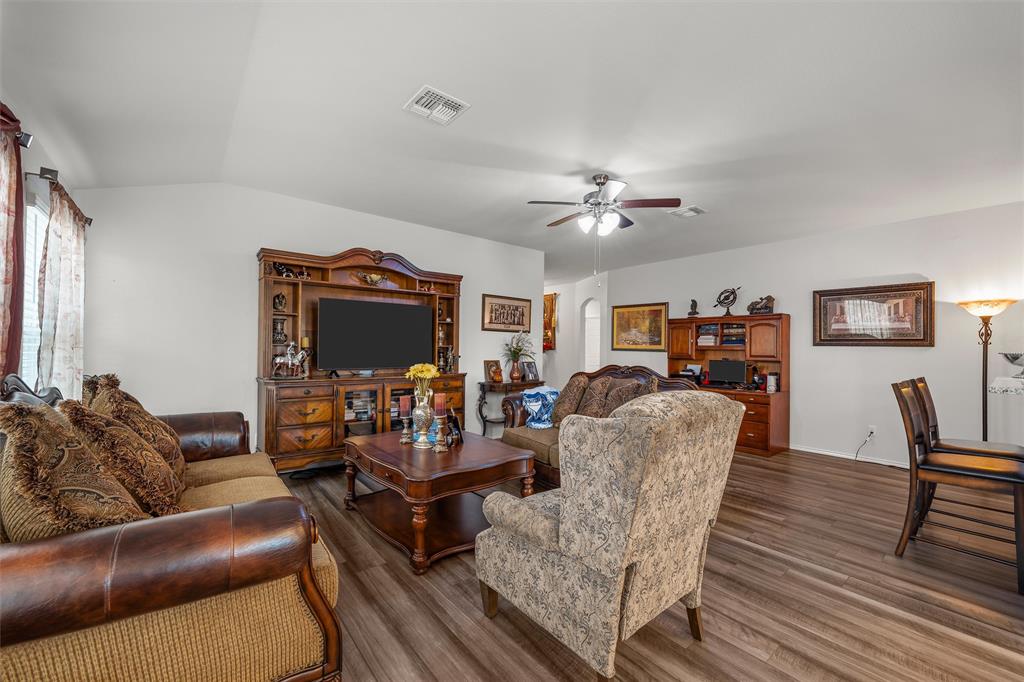 2912 Brosnan Road Lorena, TX 76655 - Photo 6 of 25 a living room with furniture and a chandelier