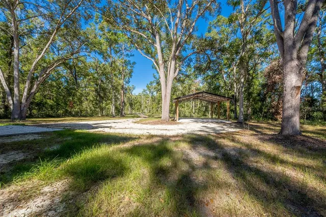 a view of a garden with a building