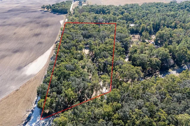 an aerial view of a houses with outdoor space