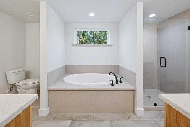 a bathroom with a shower and a sink