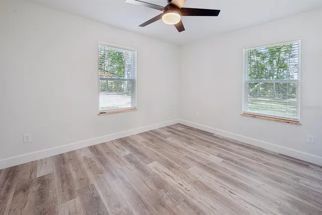 a bathroom with a sink a toilet and a shower
