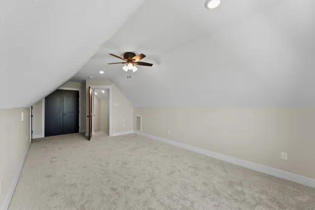 a view of an house with backyard space and a lake view