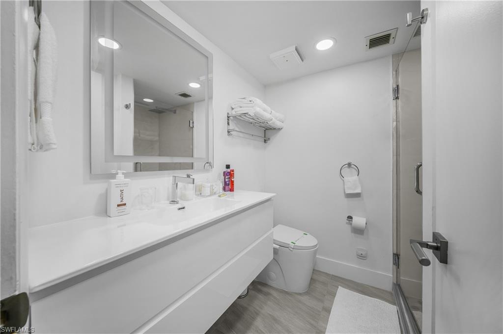 201 South Collier Boulevard, Unit 3102 Marco Island, FL 34145 - Photo 20 of 35 a bathroom with a sink toilet and shower