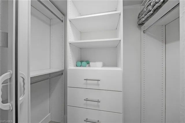 a bedroom with a bed and a table