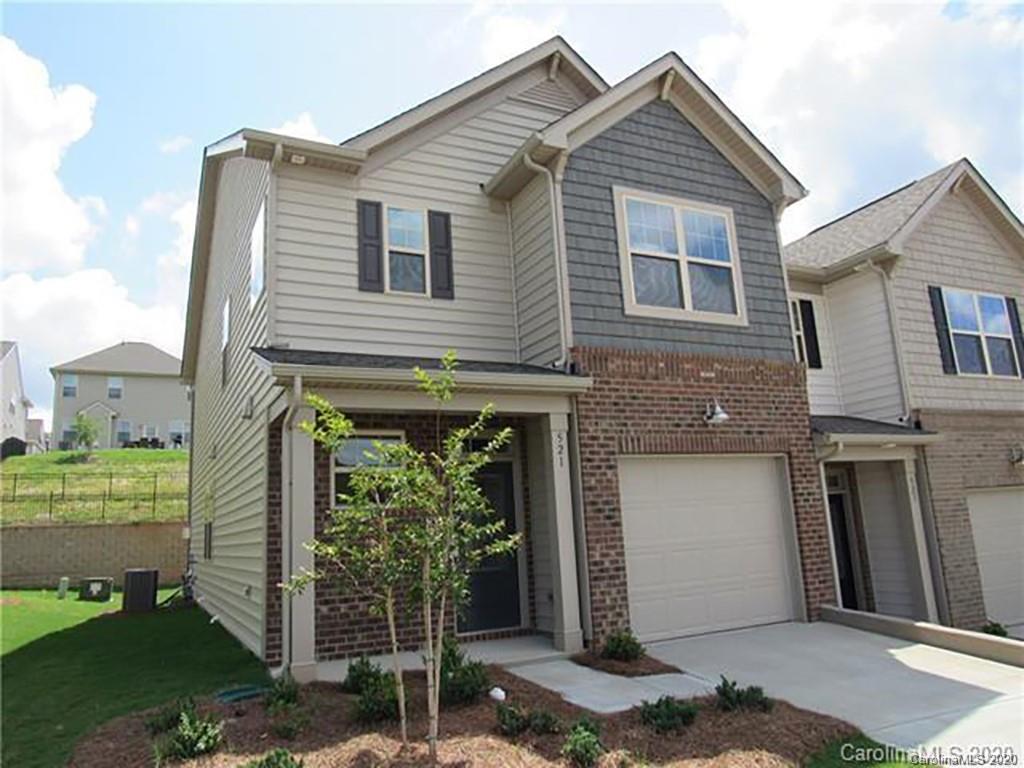 521 Common Raven Court Fort Mill, SC 29715 - Photo 1 of 25 a front view of a house with a yard