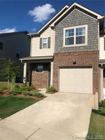 521 Common Raven Court Fort Mill, SC 29715 - Photo 2 of 25 a front view of a house with a yard and garage
