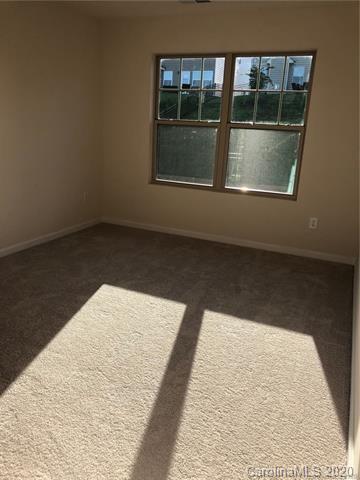 521 Common Raven Court Fort Mill, SC 29715 - Photo 15 of 25 wooden floor in an empty room