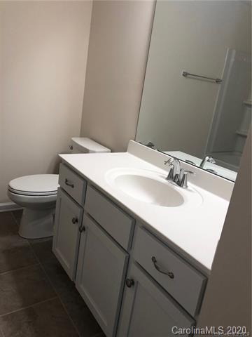 521 Common Raven Court Fort Mill, SC 29715 - Photo 16 of 25 a bathroom with a sink toilet and vanity