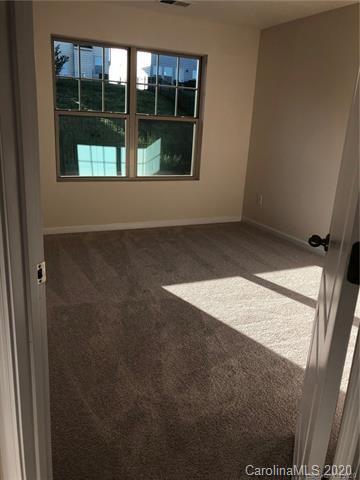 521 Common Raven Court Fort Mill, SC 29715 - Photo 17 of 25 a view of an empty room with a window