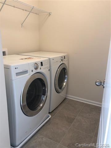 521 Common Raven Court Fort Mill, SC 29715 - Photo 18 of 25 a utility room with dryer and washer