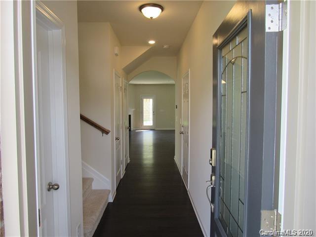 521 Common Raven Court Fort Mill, SC 29715 - Photo 3 of 25 a view of a hallway with wooden floor