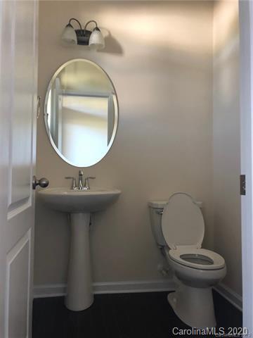 521 Common Raven Court Fort Mill, SC 29715 - Photo 5 of 25 a bathroom with a toilet sink and mirror