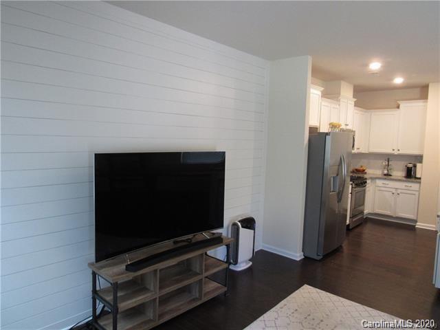 521 Common Raven Court Fort Mill, SC 29715 - Photo 10 of 25 a living room with furniture and a flat screen tv