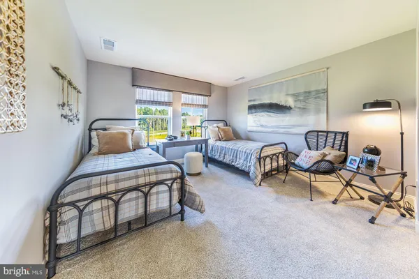 a kitchen with a sink stove and chairs