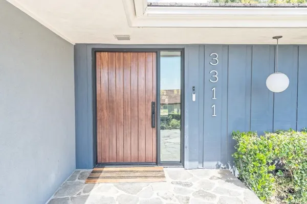 a view of a door and a window