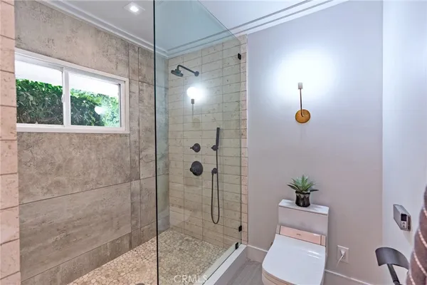 a bathroom with a shower and toilet
