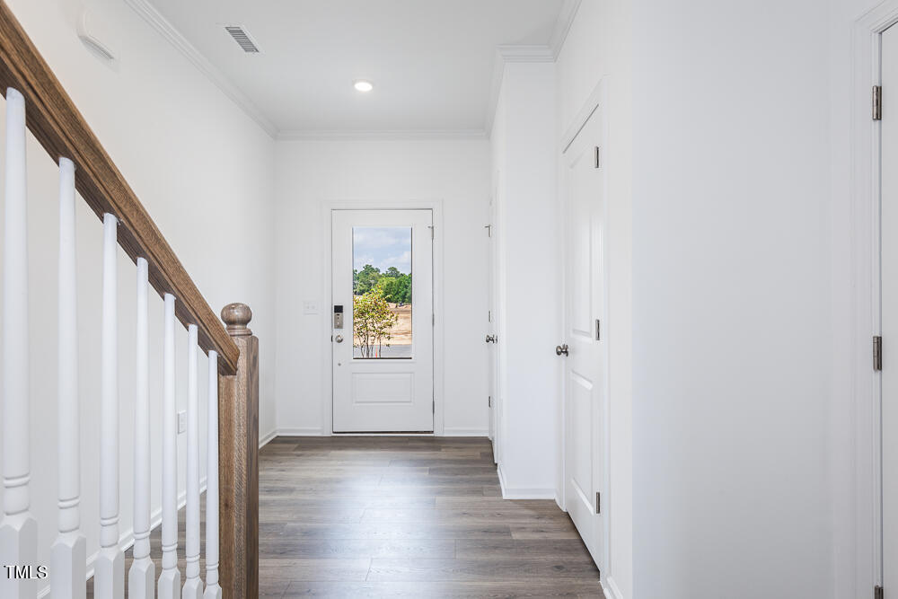 161 Charlie Smith Road Angier, NC 27501 - Photo 12 of 57 a view of an entryway with wooden floor