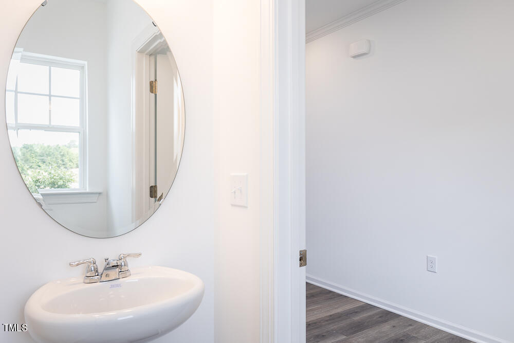 161 Charlie Smith Road Angier, NC 27501 - Photo 14 of 57 a bathroom with a sink and a mirror
